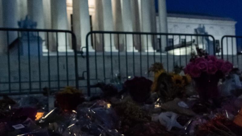 A candle lit before the White House in honor of the late Supreme Court Justice, Ruth Bader Ginsburg.