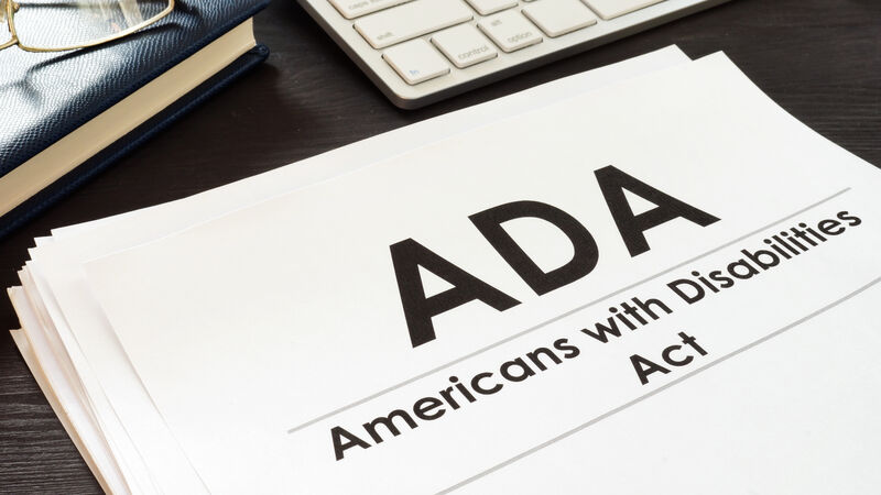 Paper on desk that reads ADA Americans with Disabilities Act
