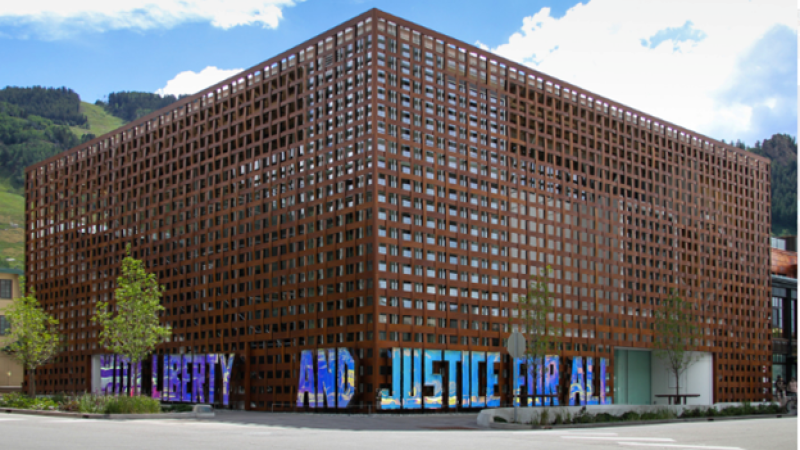 Text-based artwork installed on the exterior of the Aspen Art Museum. Oversized polished stainless steel letters spell the familiar phrase “With Liberty and Justice for All” and reflect both natural and urban surroundings.