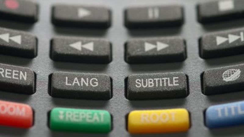 Close-up shot of a remote control and its different buttons.