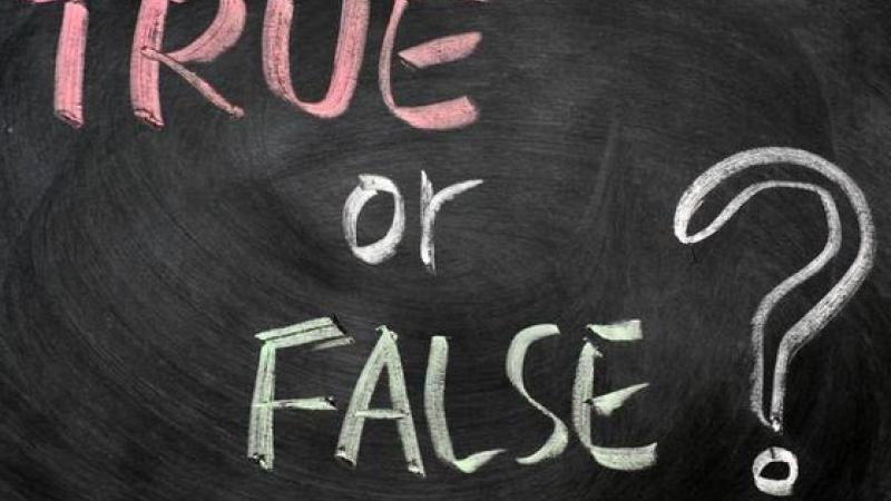 Chalkboard sign that reads "True or False?"