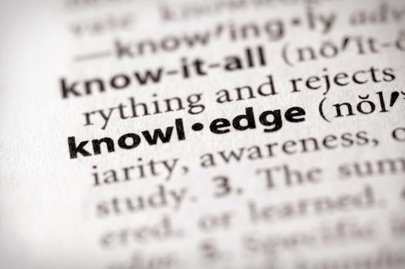 : A zoomed in photo of a dictionary page, highlighting the word knowledge.