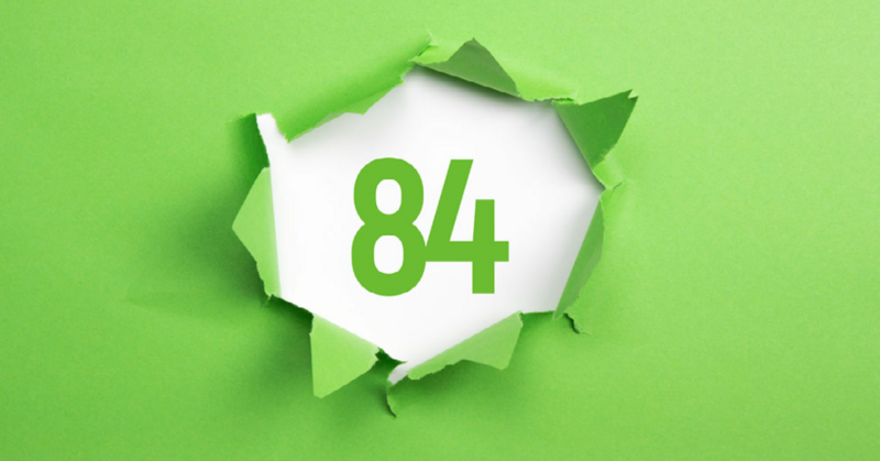 green background, center of the background is the number 84 in green, while the green is tore up to expose the number