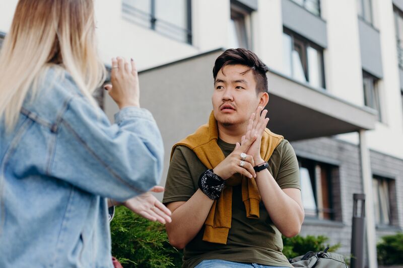 people communicating in sign language