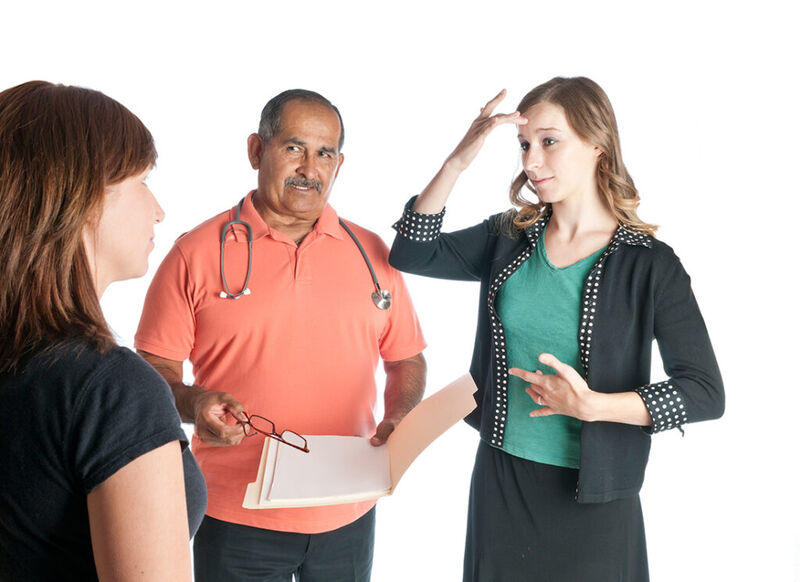 a doctor asking a patient if they are sick, the patient is looking at an ASL interpreter signing "sick"