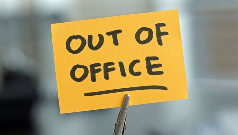 a post it saying Out of Office
