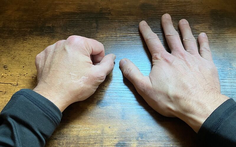 a pair of hands on a desk