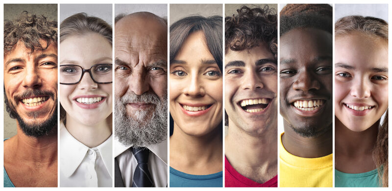 portraits 7 smiling faces, each person representing a diverse sex, skin color, and age placed side by side
