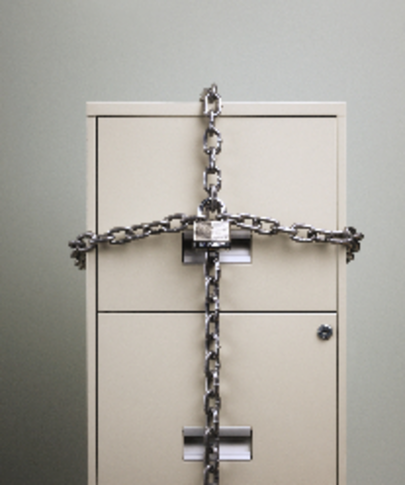 filing cabinet with drawers locked with chains