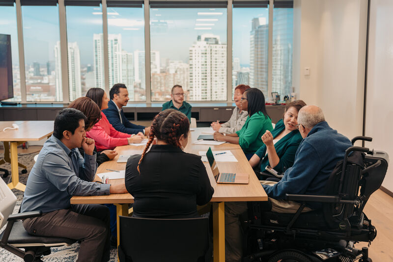 a group of diverse colleagues working together in an office