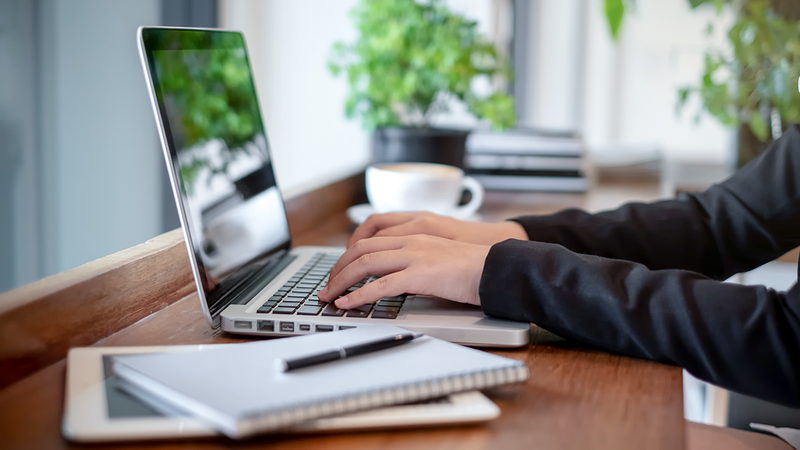 person working on a laptop computer at a desk