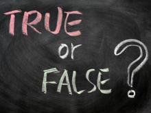 Chalkboard sign that reads "True or False?"