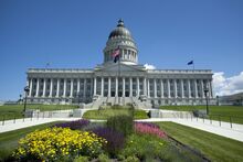 a wide view of the Utah's State Capitol building on a bright, blue sky day
