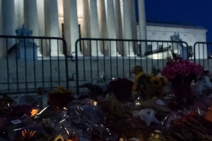 A candle lit before the White House in honor of the late Supreme Court Justice, Ruth Bader Ginsburg.