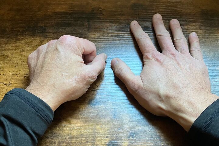 a pair of hands on a desk