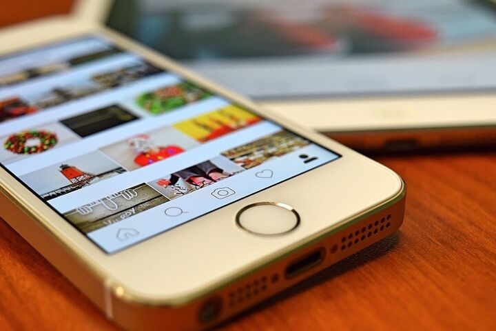 a close-up of a cell phone with Instagram open on the screen