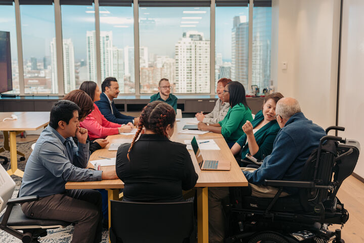 a group of diverse colleagues working together in an office
