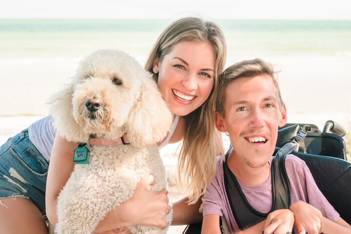 Shane and Hannah Burcaw with their Labradoodle, Chloe.
