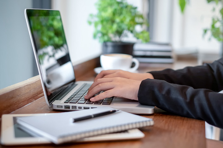 person working on a laptop computer at a desk